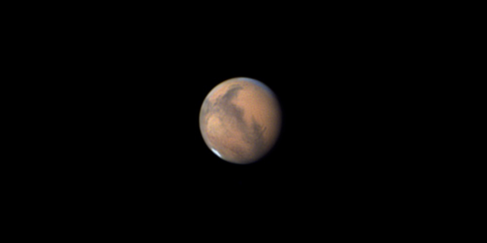 De planeet Mars, gezien door een telescoop.